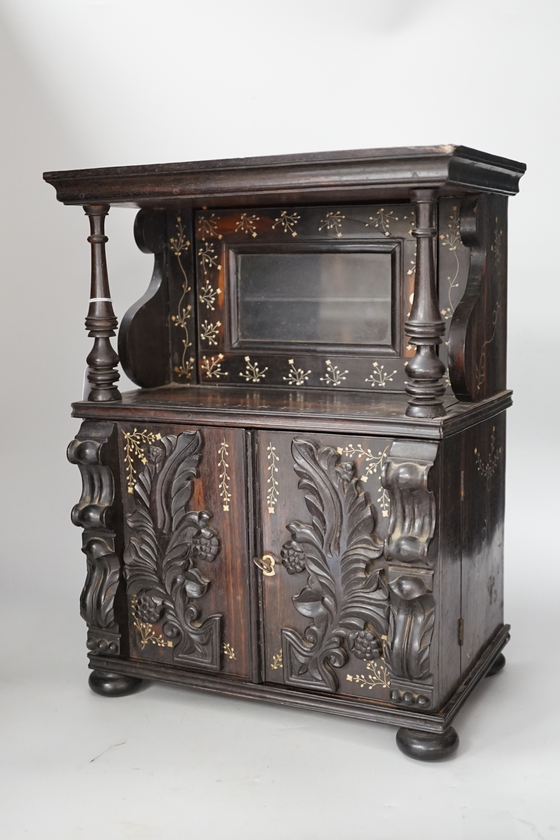 A mid 19th Anglo-Ceylonese ebony and bone inlaid writing box modelled as a parlour cabinet, 29.5cm wide x 40cm high